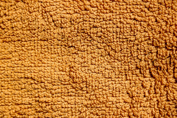 Brown terry towel textured background close up