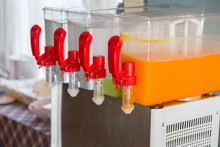 Orange Juice And Water In Dispenser And Glasses