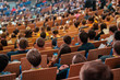 © Anton Gvozdikov - Business conference attendees sit and listen