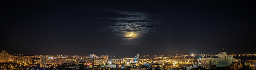 Wall Mural - city scape at night scene with moon.
