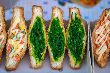 Seaweed Salad Sandwich For Sell At Street Food Market In Thailand . Tasty Green Seaweed Salad Sandwich Close Up