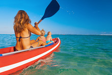 Happy Family - Young Mother, Children Have Fun On Boat Walk. Woman And Child Paddling On Kayak. Travel Lifestyle, Parents With Kids Recreational Activity, Watersports On Summer Sea Beach Vacation.