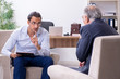 © Elnur - Old man visiting young male doctor psychologist