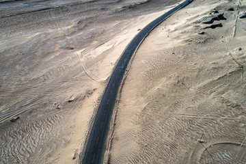 Wall Mural - aerial view of desert road in northwest of China