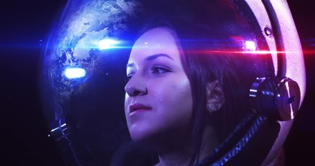 Wall Mural - portrait 4k shot of the young smiling female astronaut in space helmet. she is exploring outer space