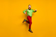 © deagreez - Full length photo of careless childish crazy funky man jump pull his modern suspenders scream feel rejoice wear stylish outfit shoes isolated over yellow color background