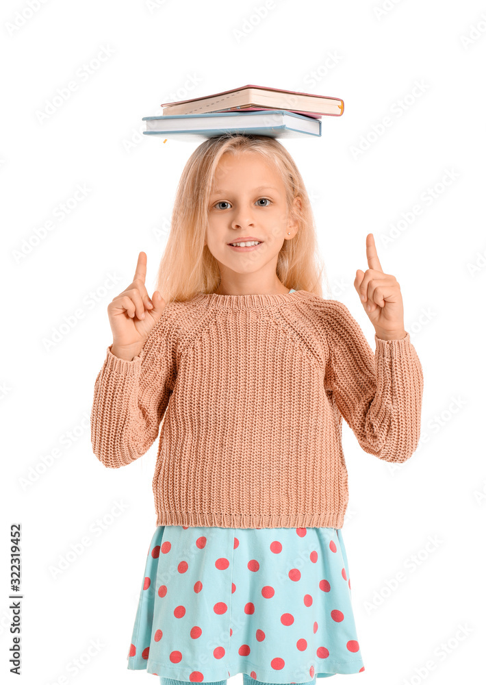 Little girl with books on white background