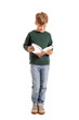 © Pixel-Shot - Little boy reading book on white background