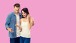 © vgstudio - Love, new parents and happy family concept - young happy couple, finding out results of a pregnancy test. Over rose pink color background. Copy space for some text.