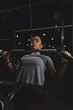 © LIGHTFIELD STUDIOS - selective focus of african american girl with tattoo training on gym machine