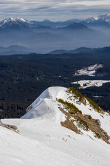 Mountain cliff covered in snow, Bohinj