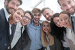 © ASDF - close up.a team of young business people looking at the camera.