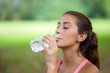 © FotoArtist - young woman drinking water from a bottle