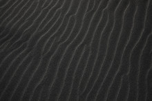 Black Icelandic Basalt Sand. Embossed Sandy Texture. Wavy Background. Abstract Pattern. Nature Design. Reynisfjara Beach With Black Volcanic Sand. Stokksnes Dunes. Reynisdrangar, Vik, Iceland Europe