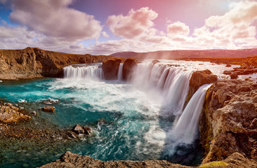 Wall Mural - Panorama of most famous place of Golden Ring Of Iceland. Godafoss waterfall near Akureyri in the Icelandic highlands, Europe. Popular tourist attraction. Travelling concept background. Postcard.