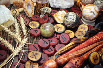 Witching still life of carved Scandinavian runes and crafted stones