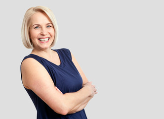 friendly smiling middle-aged business woman isolated on white ba