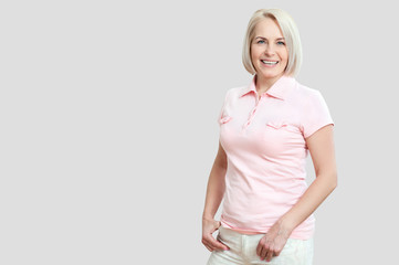 Wall Mural - friendly smiling middle-aged woman isolated on white background