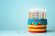 © Ruth Black - Brightly colored birthday cake with candles