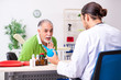 © Elnur - Old man visiting young male doctor gastroenterologist