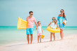 © travnikovstudio - Happy beautiful family with kids on the beach