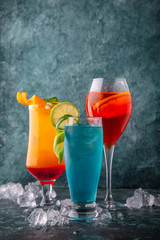 Wall Mural - Set of alcoholic and non-alcoholic drinks. On a turquoise background. Cocktail menu. Sea mood concept.