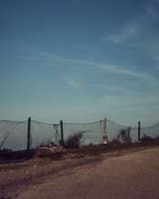 Fence Along Dirt Road
