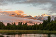 © Westend61 - New Zealand, Westland District, Fox Glacier, Lake Matheson at dawn with mountains shrouded in fog in background
