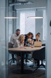 © Westend61 - Business team with boy looking at laptop in office