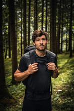 Portrait Of A Man With Backpack On A Hiking Trip In Forest, Karwendel, Tyrol, Austria
