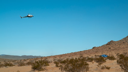 Wall Mural - Helicopter Chasing Off-road Race Trophy Truck