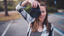 A Woman Taking A Photograph