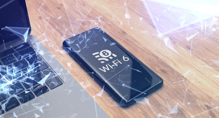 Canvas Print - wi fi 6 logo on smartphone with laptop background. wi fi 6 telecommunications new generation network