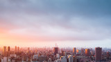 Fototapeta Miasta - Landscape of blur image city skyline at sunset for background