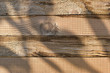 © sutichak - wood barn wall plank texture background with light and shadow in the morning day, top view of old wooden table
