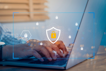 person using a laptop computer with technology cybersecurity and privacy concept. protection and saf