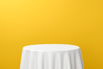 Poster - White dinner table or empty pedestal display on vivid yellow background with elegant fabric. Blank stand for showing product. 3D rendering.