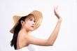© Kawee - Beautiful Young Asian woman with clean fresh white skin raising her arm and hand in protection sunshine in isolated white background. Facial treatment, cosmetology, sun screen cream advertise concept.
