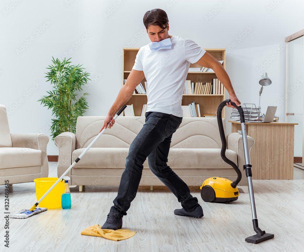 Man husband cleaning the house helping wife Stock Photo | Adobe Stock