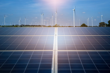 solar energy panel photovoltaic cell and wind turbine farm power generator in nature landscape for p