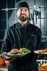 Wall Mural - Smiling Chef Serving Organic Vegan Burger with Fresh Salad