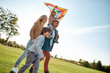 © Svitlana - Caring. Honesty. Respect. Responsibility. Happy family playing a kite. Outdoor family weekend