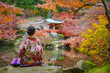 © ID_Anuphon - woman in old fashion style traditional kimono, sits in the middle of park of the village garden in autumn, travel and visit japan on incoming sport event