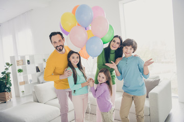 Sticker - Family woman anniversary celebration concept. five people daddy mommy enjoy spend free time together three little preteen kids hold many air balls baloons in house room with couch