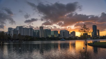 Fototapete - Timelapse of a colorful sunset at Lake Eola and city skyline in Orlando, Florida