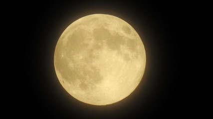 close-up of the full moon with black background