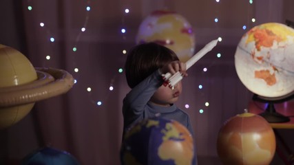 Wall Mural - Space Travel Game Inspiration Spaceship. Little Kid Boy Astronaut Launching Toy Rocket From Spaceport Through Planets. Child Dreamer Playing With Toy Space Rocket Flying Among Planets. SLOW MOTION.