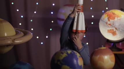 Wall Mural - Space Travel Game Inspiration Spaceship. Little Kid Boy Astronaut Launching Toy Rocket From Spaceport Through Planets. Child Dreamer Playing With Toy Space Rocket Flying Among Planets. SLOW MOTION.