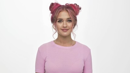 Poster - An attractive young woman with colorful hairstyle is doing a negation gesture to the camera isolated over white background