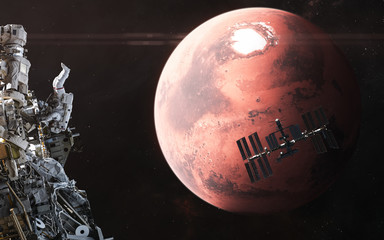Wall Mural - space stations, astronaut on the background of mars. red planet of the solar system. 3d render. scie